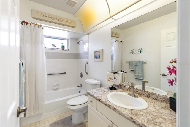 full bathroom featuring toilet, vanity, tile patterned flooring, and shower / bath combo with shower curtain