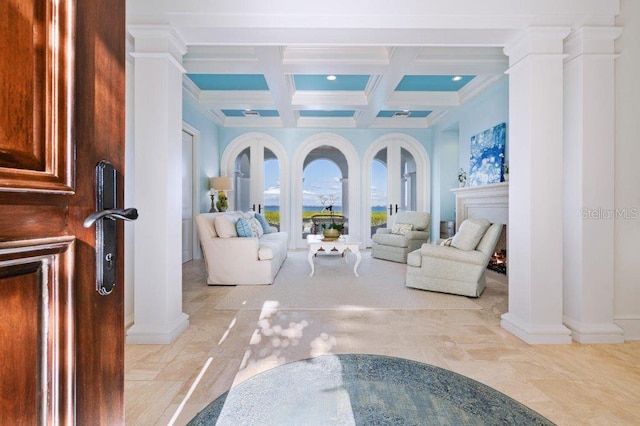 interior space featuring beam ceiling, ornamental molding, ornate columns, and coffered ceiling