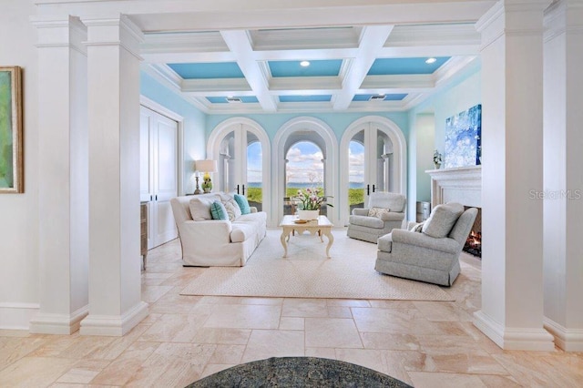 living room with coffered ceiling and beamed ceiling