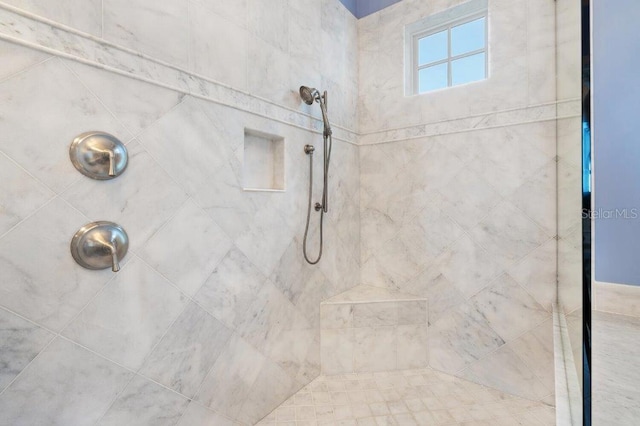 bathroom featuring tiled shower