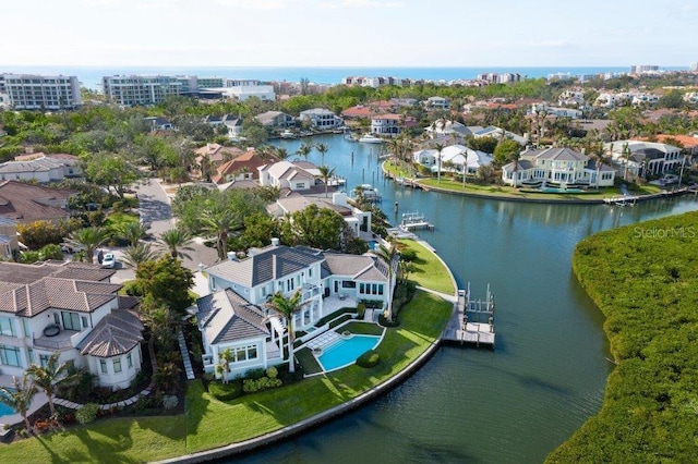 drone / aerial view with a water view