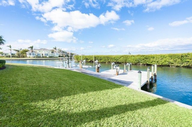 view of dock featuring a yard and a water view