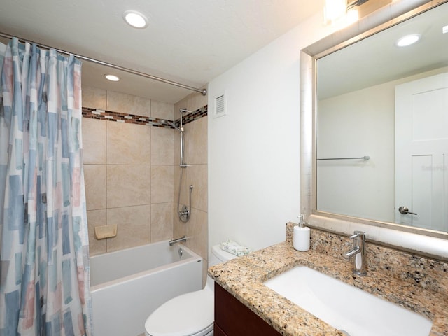 full bathroom with vanity, toilet, and shower / bath combo