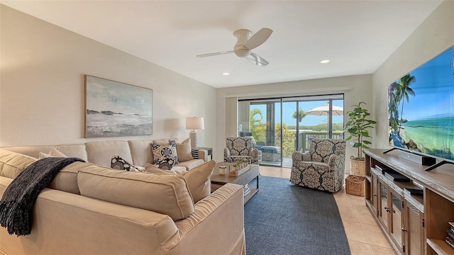 living room with ceiling fan and light tile patterned floors