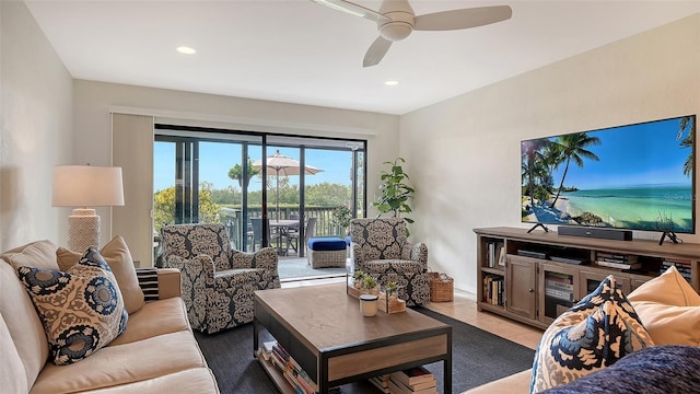 living room with light tile patterned floors and ceiling fan