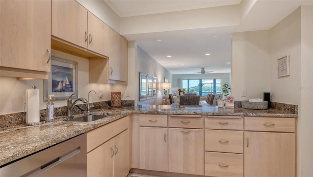 kitchen with light brown cabinetry, sink, dishwasher, kitchen peninsula, and stone counters