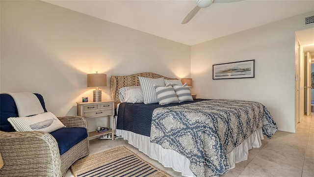 tiled bedroom with ceiling fan