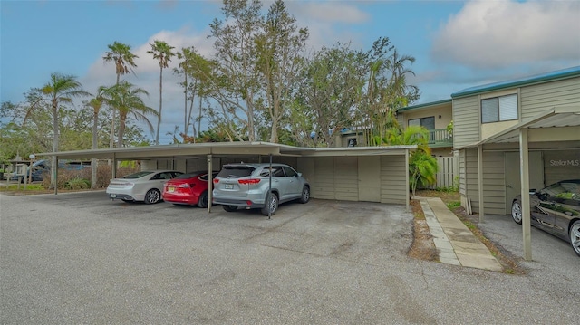 view of parking / parking lot featuring a carport