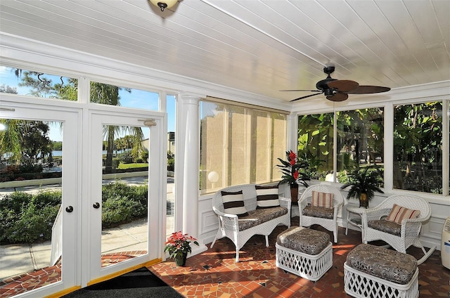 sunroom featuring wooden ceiling and ceiling fan