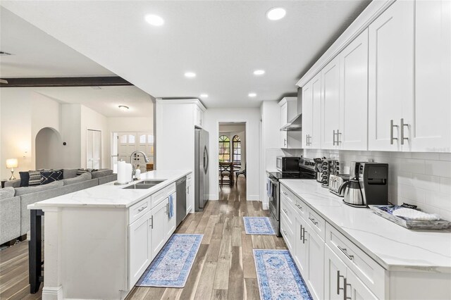 kitchen featuring white cabinetry, stainless steel appliances, and sink