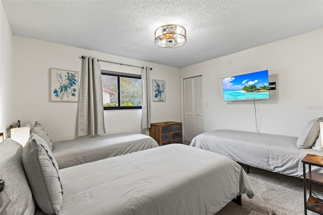 bedroom featuring a closet and a textured ceiling