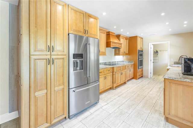 kitchen featuring appliances with stainless steel finishes, light stone countertops, and custom exhaust hood