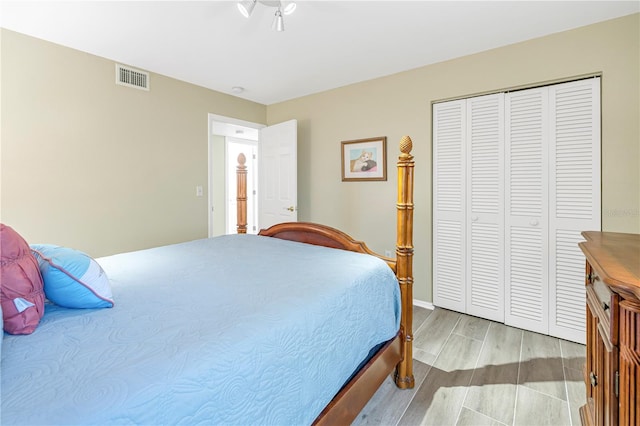 bedroom featuring a closet and light wood-type flooring