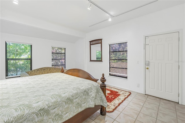 bedroom featuring light tile patterned floors