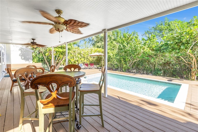 wooden deck featuring ceiling fan