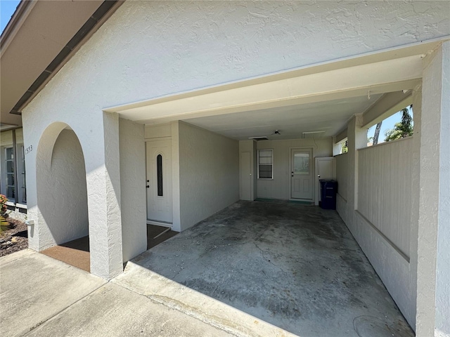 exterior space with a carport