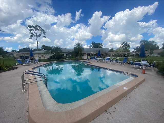 view of swimming pool with a patio area