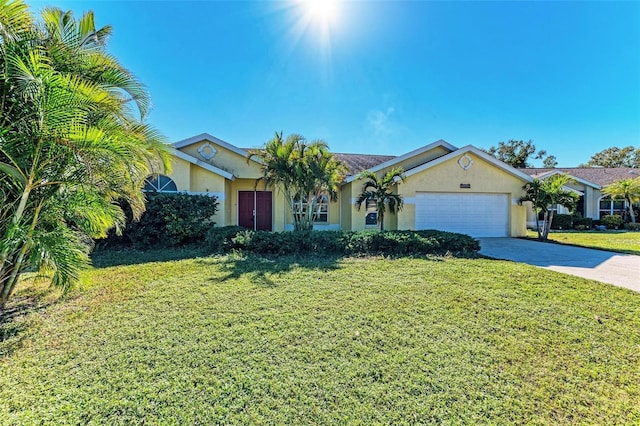 ranch-style house with a garage and a front lawn