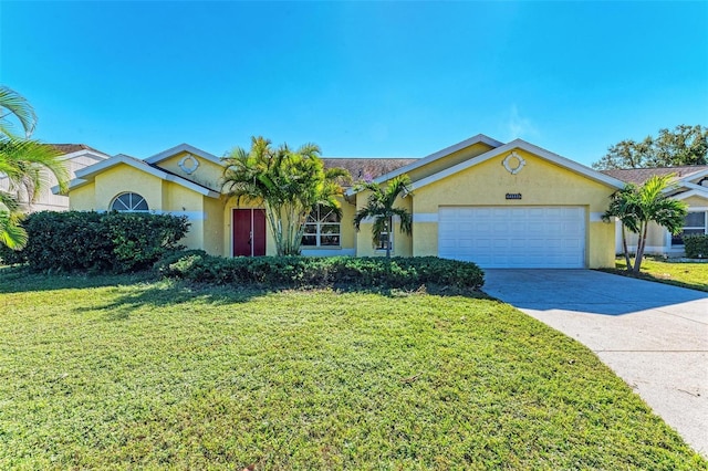 single story home featuring a garage and a front lawn