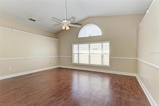 unfurnished room featuring ceiling fan, vaulted ceiling, and dark hardwood / wood-style floors