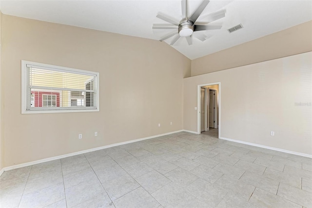 empty room featuring lofted ceiling and ceiling fan