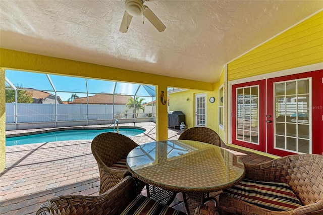 exterior space with french doors, a lanai, ceiling fan, and a patio