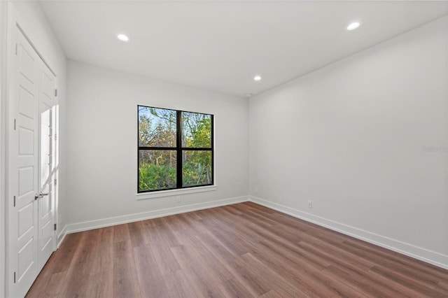 unfurnished room featuring wood-type flooring