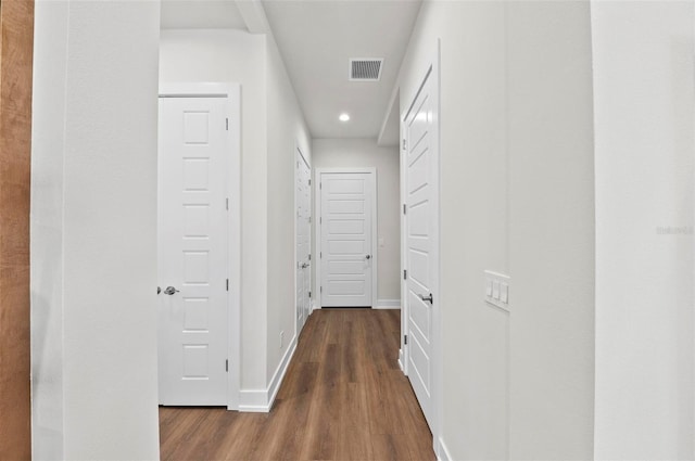 hall with dark hardwood / wood-style floors