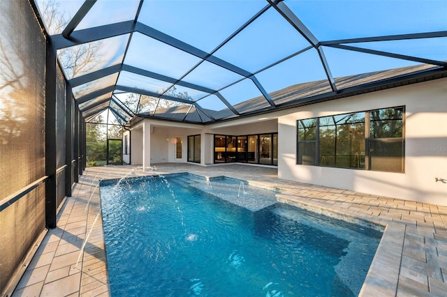 view of swimming pool featuring a patio area, a lanai, and pool water feature