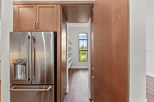 11323 Rivers Bluff Cir, Lakewood Ranch, FL 34202 - kitchen featuring baseboards, brown cabinetry, wood finished floors, and stainless steel refrigerator with ice dispenser