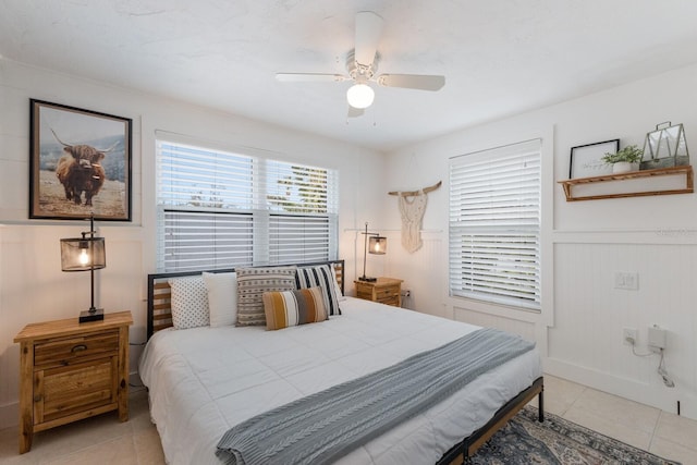 bedroom featuring light tile patterned flooring and ceiling fan