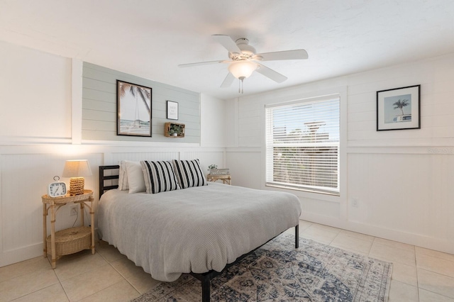 tiled bedroom with ceiling fan