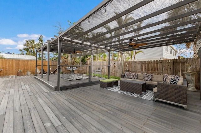 deck with an outdoor living space and a pergola