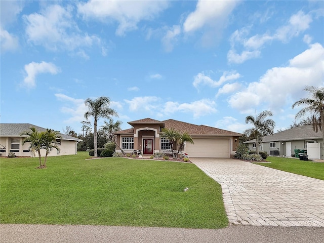 view of front of home featuring a front lawn and a garage