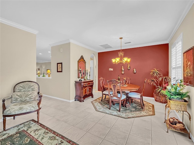 dining space featuring light tile patterned floors, crown molding, and a notable chandelier