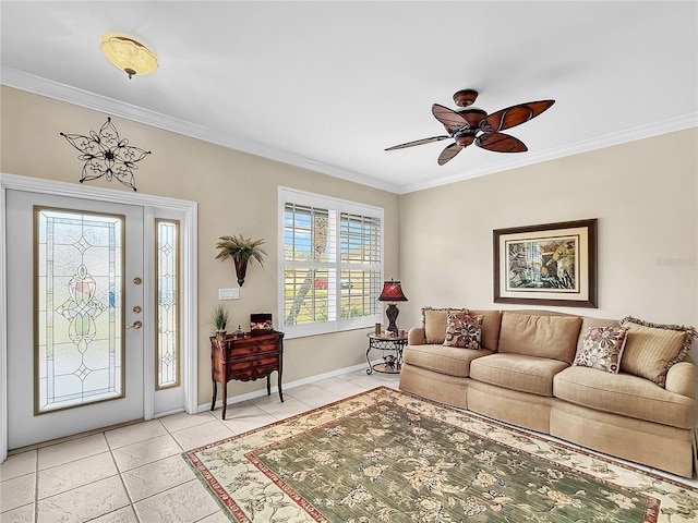 tiled entrance foyer with ceiling fan and crown molding