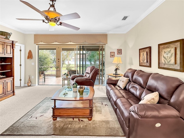 living room featuring ceiling fan, light colored carpet, and crown molding