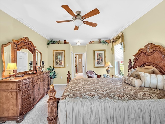 bedroom with ceiling fan, crown molding, and light colored carpet