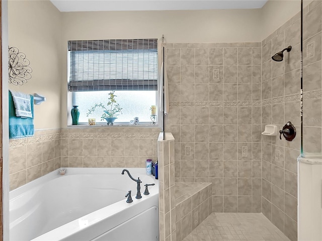 bathroom featuring separate shower and tub