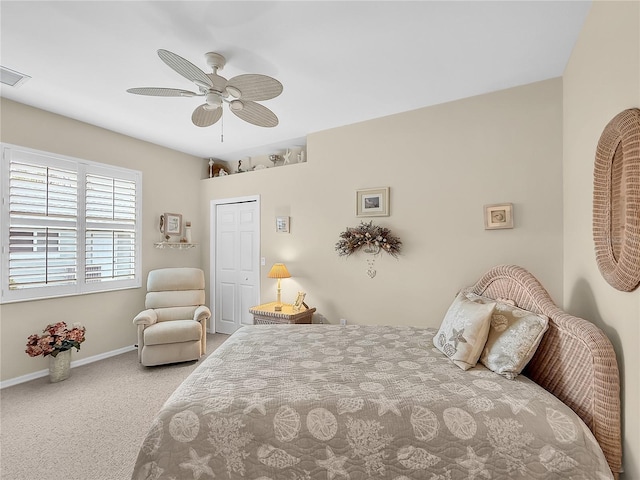 bedroom featuring ceiling fan, a closet, and carpet flooring