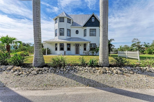 view of front facade with a porch and a front lawn