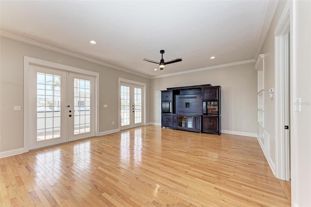 unfurnished living room featuring ceiling fan, french doors, crown molding, and light hardwood / wood-style flooring