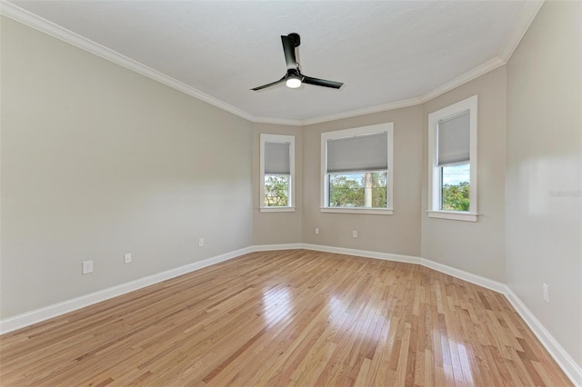 empty room with ceiling fan, light hardwood / wood-style floors, and ornamental molding