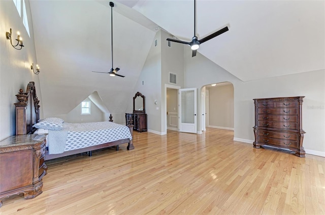 bedroom with high vaulted ceiling, ceiling fan, light wood-type flooring, and beamed ceiling