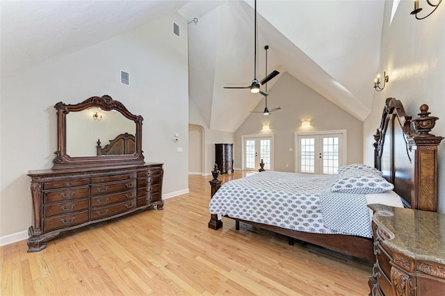 bedroom with french doors, high vaulted ceiling, light wood-type flooring, and ceiling fan