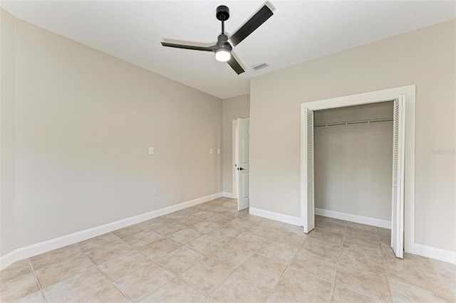 unfurnished bedroom featuring a closet and ceiling fan