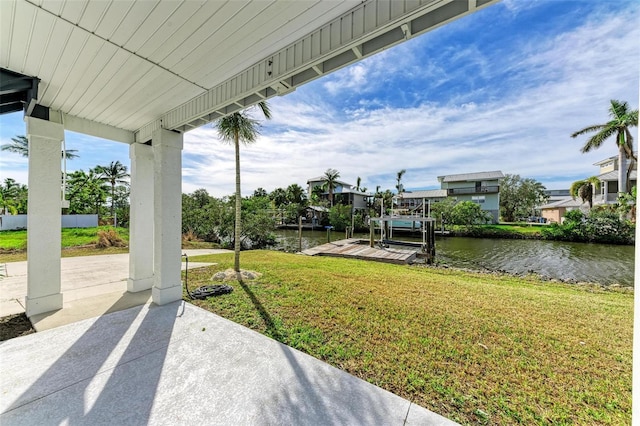 exterior space with a water view and a boat dock