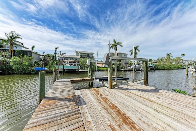 view of dock with a water view and boat lift