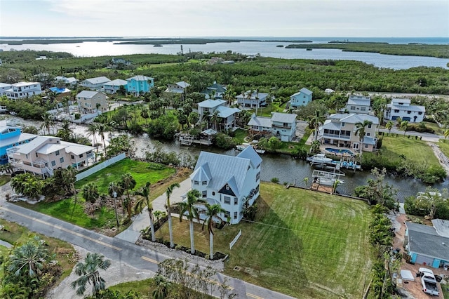 bird's eye view featuring a residential view and a water view