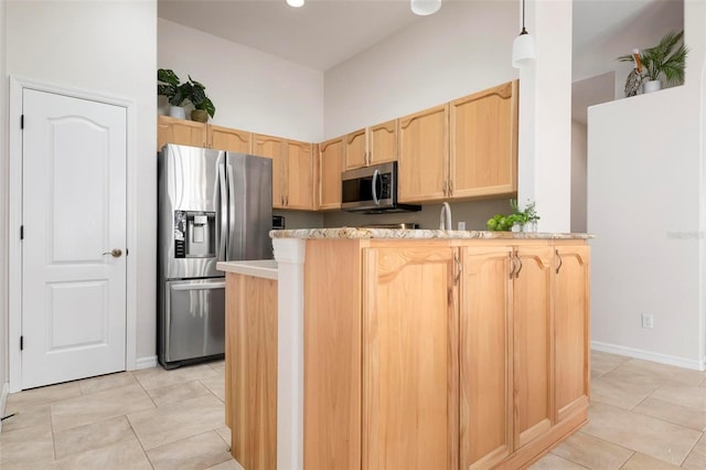 kitchen with kitchen peninsula, stainless steel appliances, decorative light fixtures, and light brown cabinets